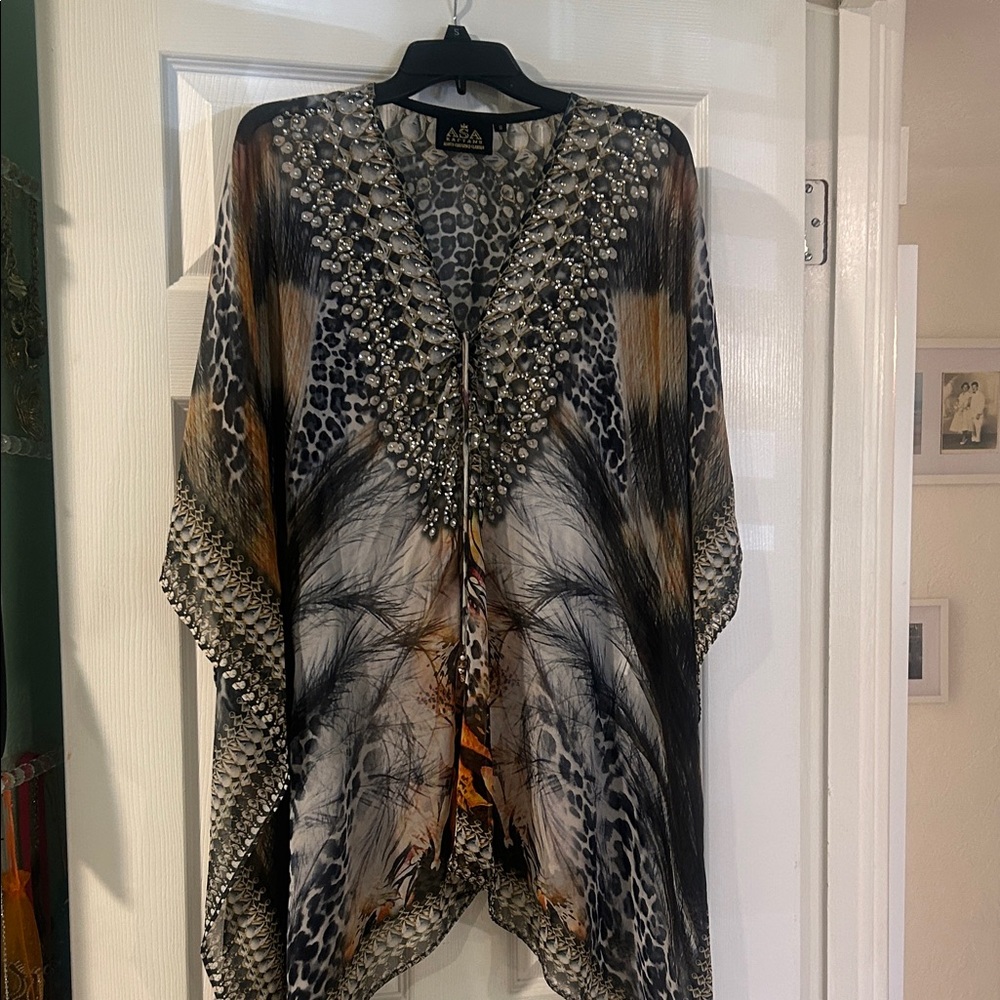 Asa Kaftan (short) asymmetrical- it’s a bathing suit cover up/top
